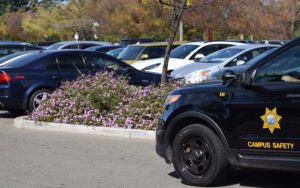 A campus safety car drives through Chabot College's parking lot B.